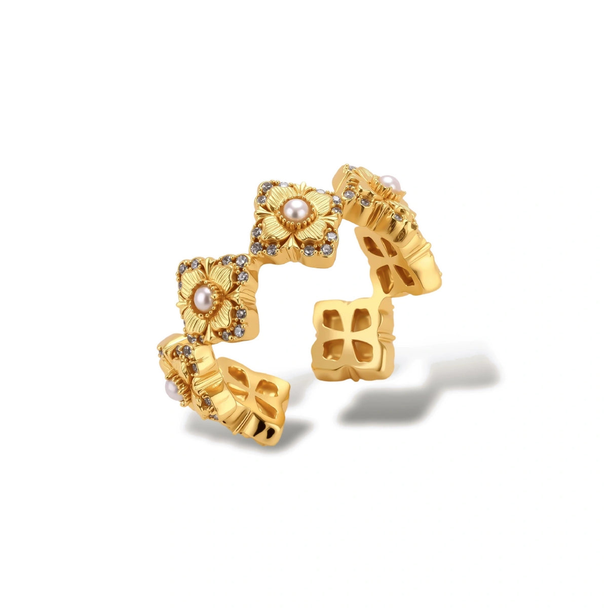Gold-plated adjustable ring with multiple flower motifs, each featuring a central pearl and cubic zirconia stones