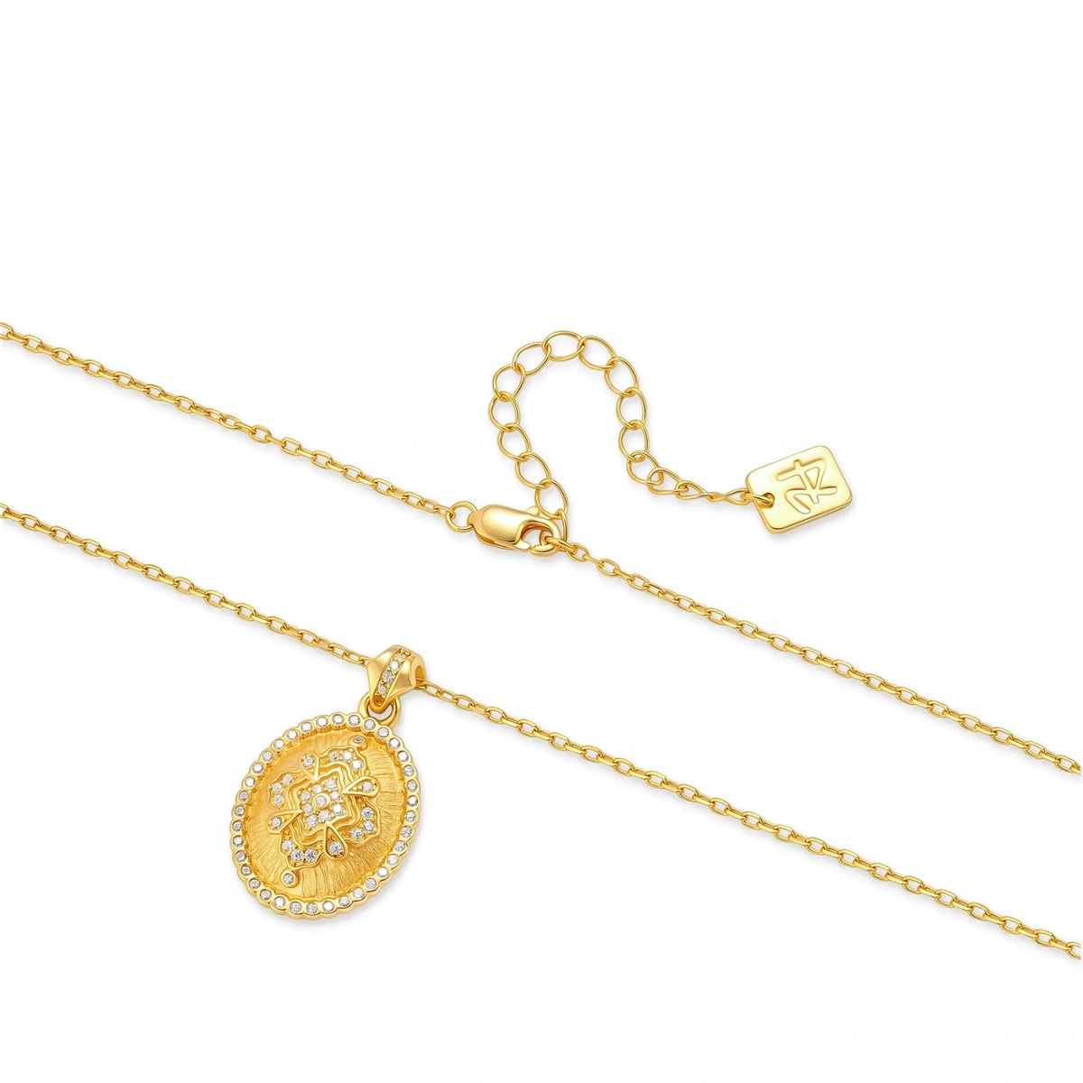 Oval gold coin pendant with pave CZ mandala motif and beaded border on an 18K gold-plated cable chain.