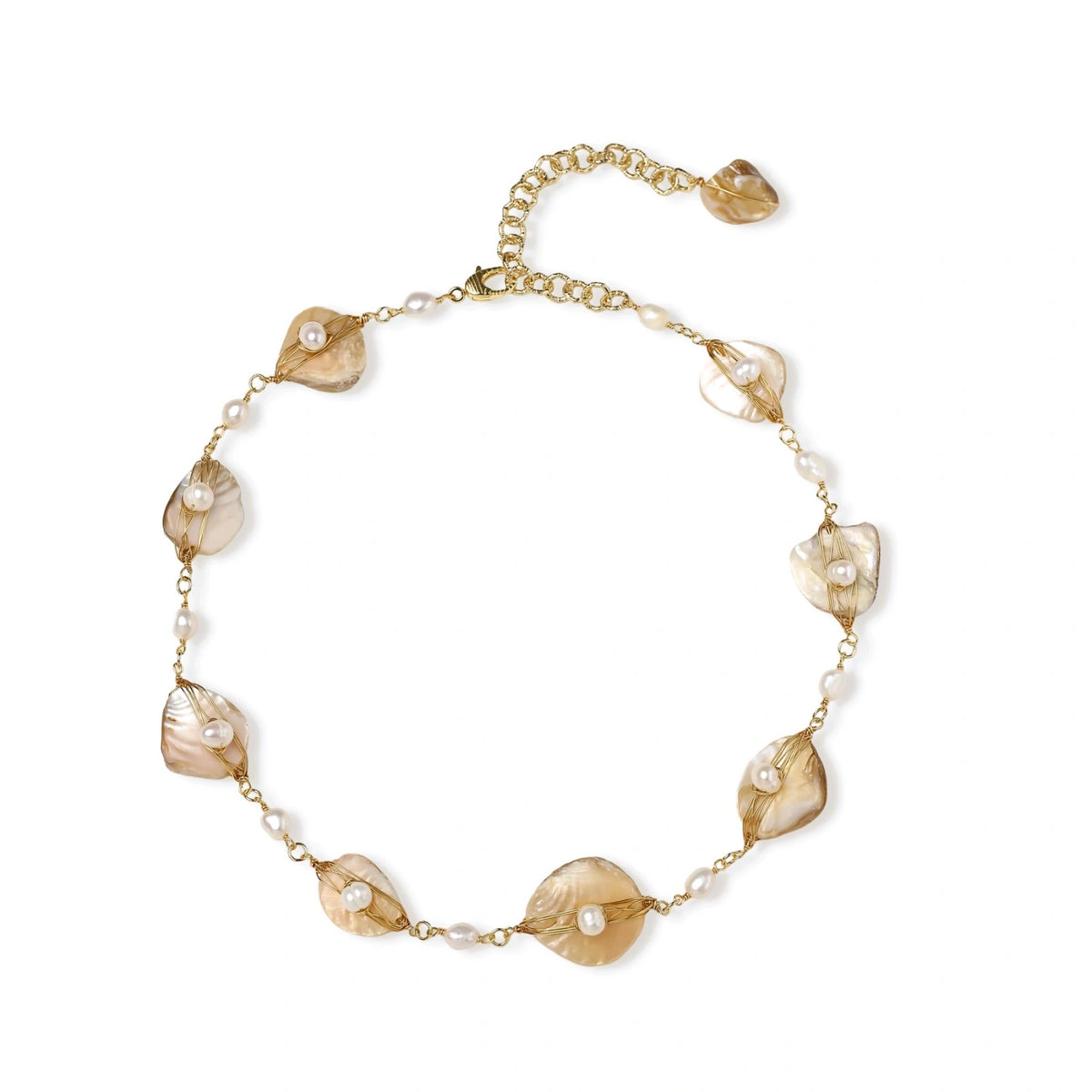 Gold-plated necklace with wire-wrapped shell pieces and freshwater pearls on neutral background, adjustable chain visible.