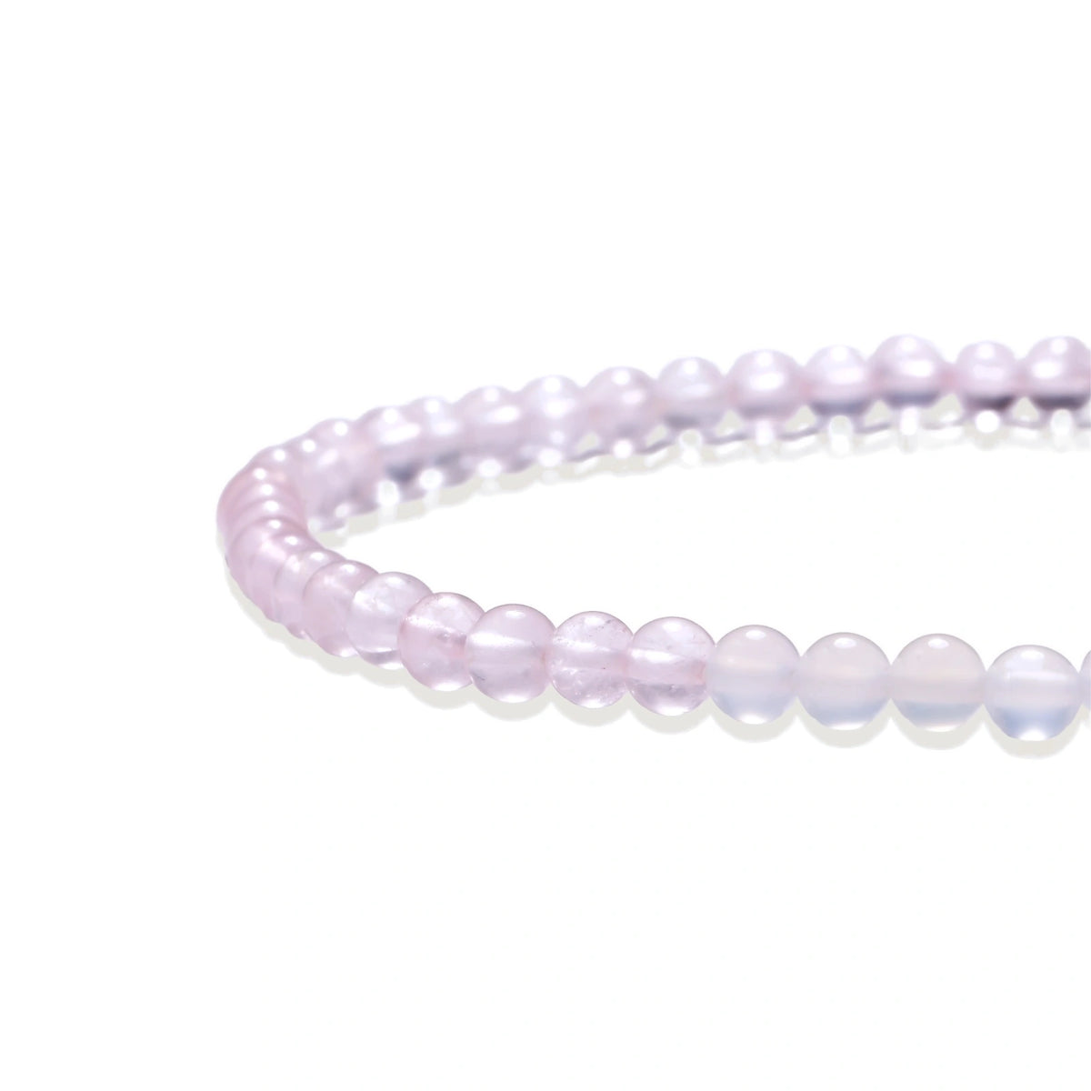 Double-wrap lavender beaded bracelet with rose quartz, pearls, gold vermeil charm and pink tassel on white background.
