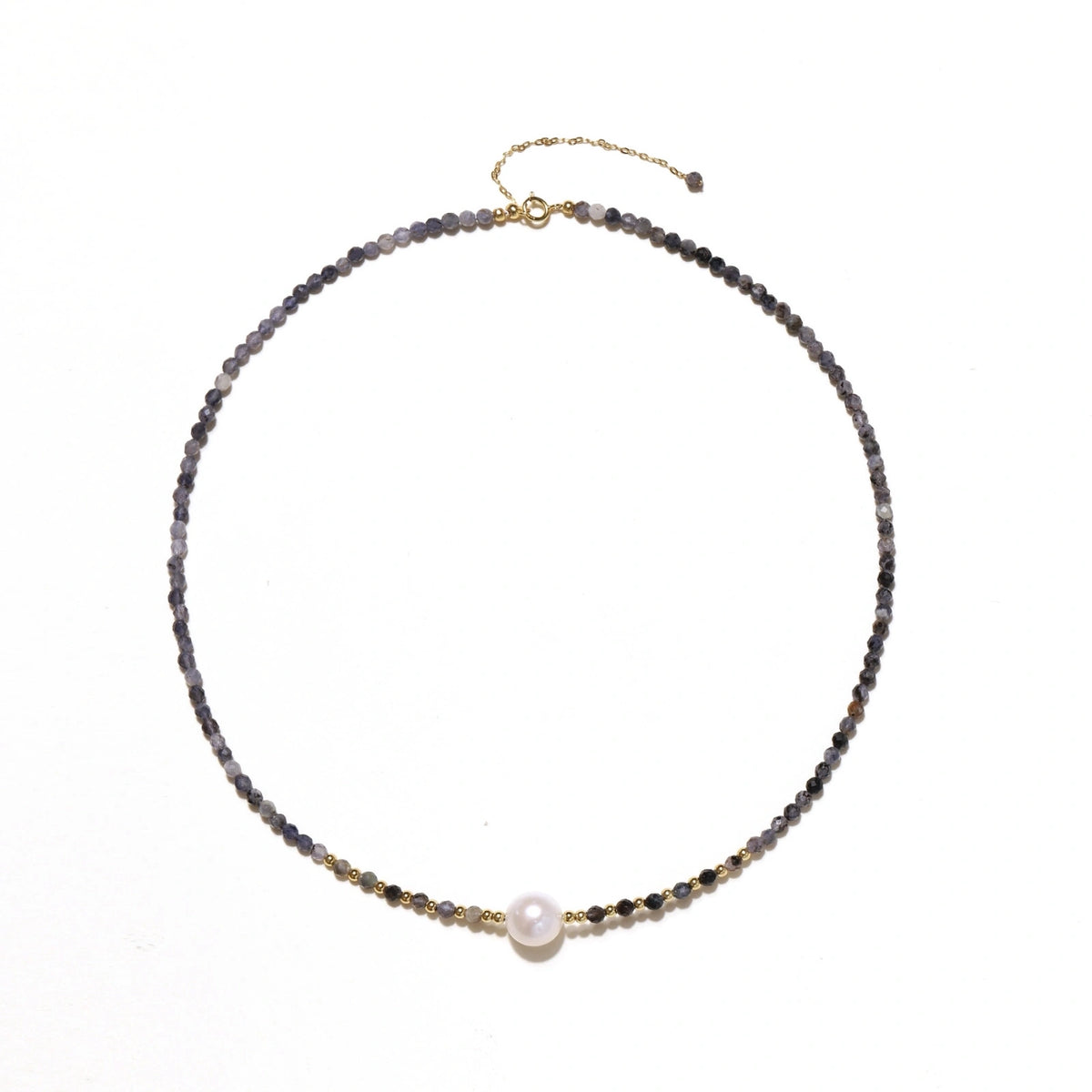 Dainty necklace with faceted purple iolite beads, gold vermeil accents, and central pink-white freshwater pearl.