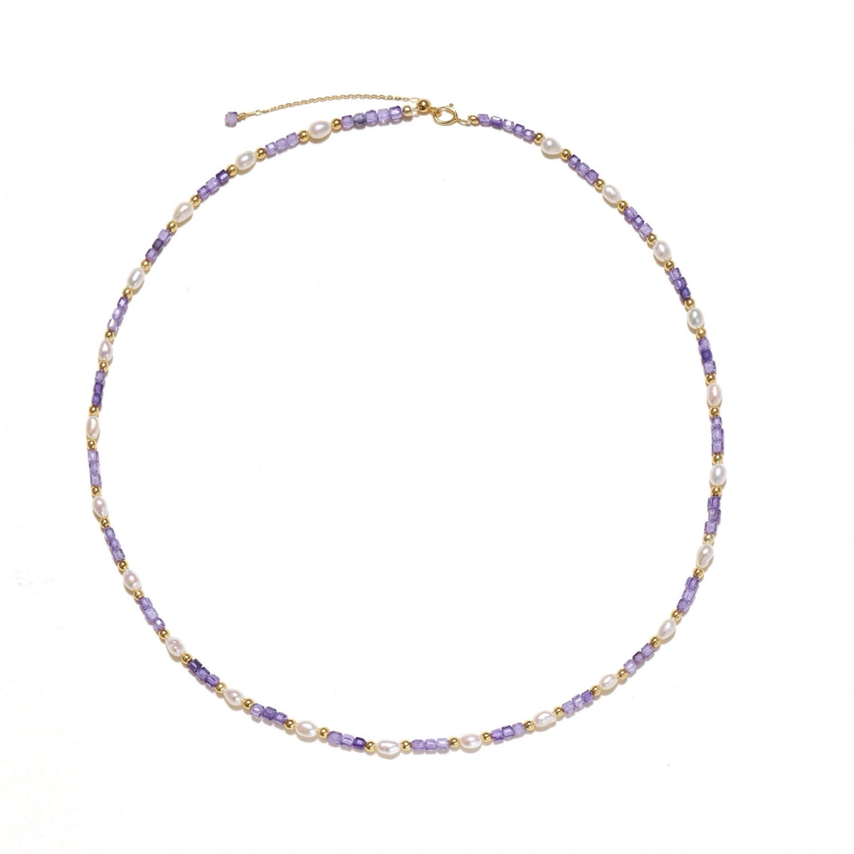 Delicate 18K gold vermeil necklace with alternating lavender zirconia beads and white freshwater pearls on cream background