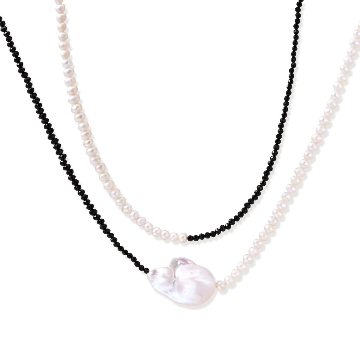 Double-strand necklace with black faceted quartz and white pearls featuring an oversized baroque pearl centerpiece