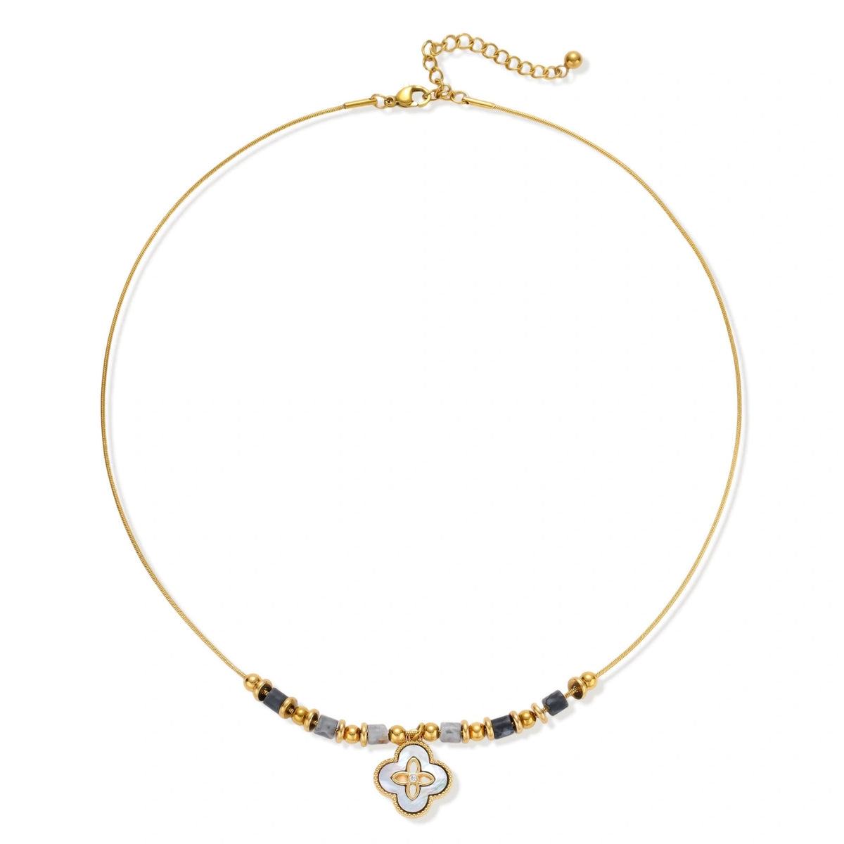Gold-toned beaded necklace with grey stones and quatrefoil abalone shell pendant on cream background.