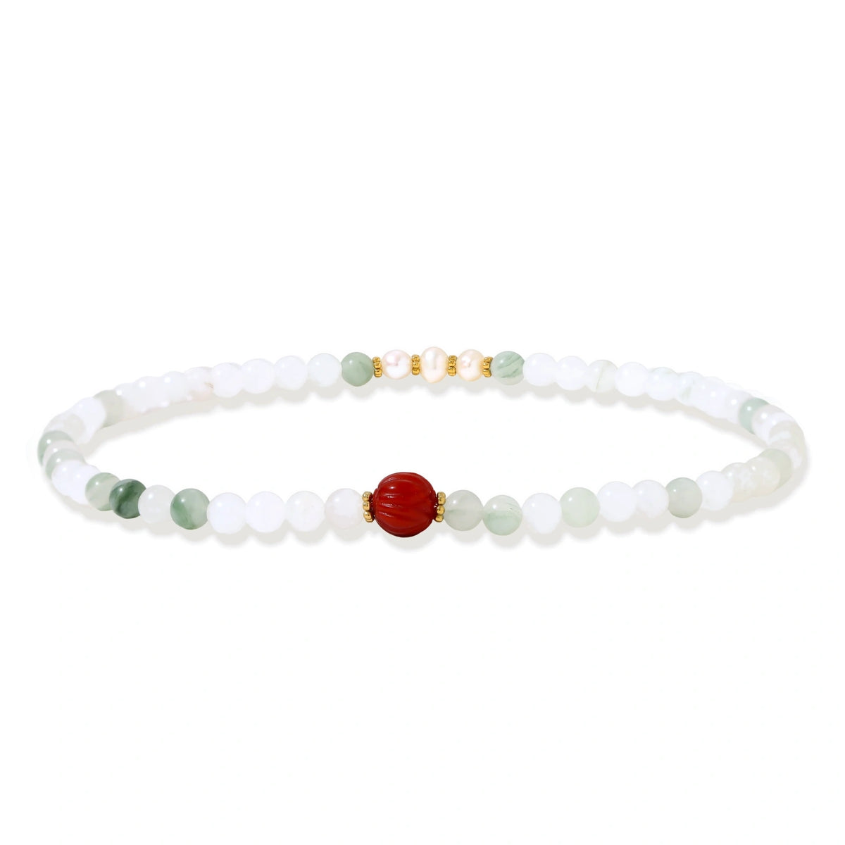 Three layered white beaded bracelets with carved orange agate lotus centerpiece and freshwater pearls on cream background.