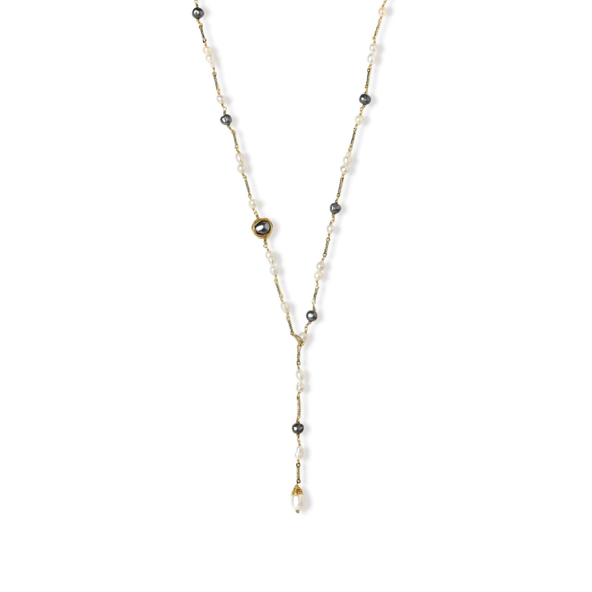 Y-shaped gold-plated necklace with white and gray freshwater pearls on cream background, showing adjustable drop design.