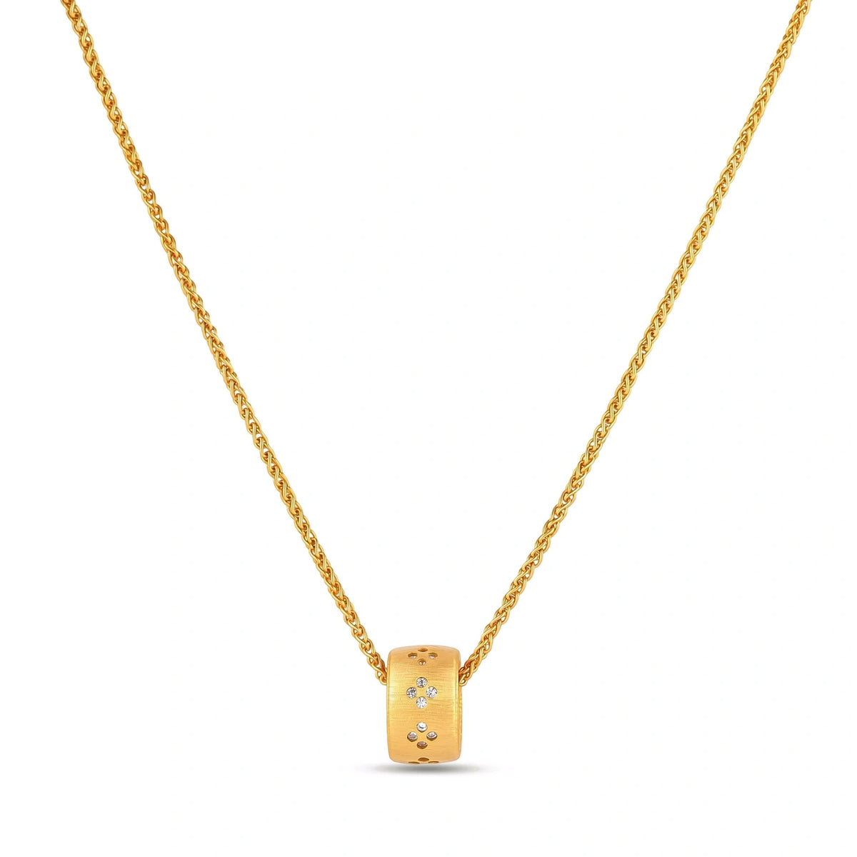Gold-plated cylindrical ring pendant with brushed finish and scattered crystal accents on a wheat-link chain, cream background.