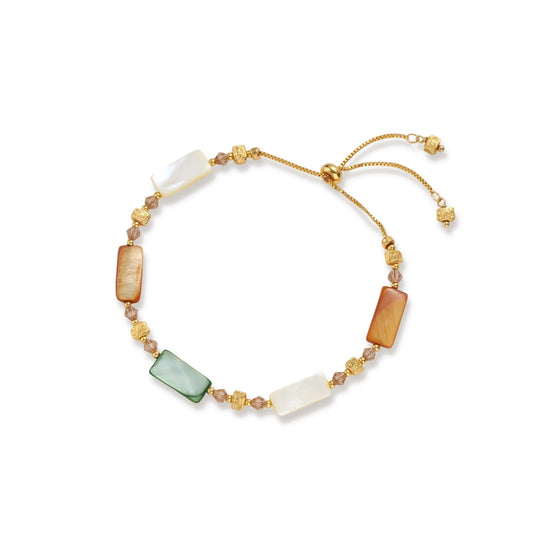 Adjustable gold-plated bracelet featuring rectangular shell beads in green, orange, and white tones on cream background.