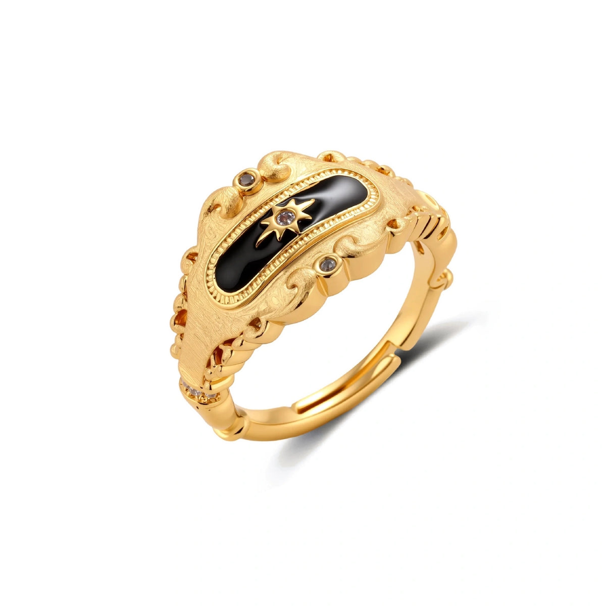 Ornate 18K gold-plated ring with black enamel center featuring star motif and decorative baroque-style edges on white background.